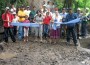 Ribbon Bridge Villagers and Ana Reyes (purple skirt) celebrate opening of foot bridge