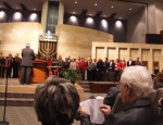 Rabbi Michael Berk (back to camera) pronounces a blessing over congregants who are past and present leaders of Jewish organizations in San Diego County