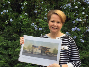 Katherine Nakamura with a rendering of Patrick Henry HS's new cultural arts facility