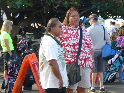 Kainoa dela Cruz, in Hawaiian shirt, waits on pier in Lahaina, Maui, for passengers on tenders from MS Zaandam