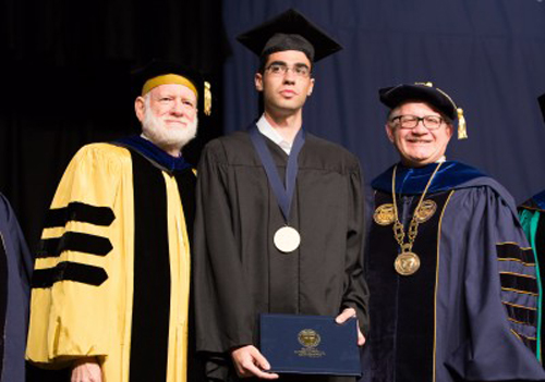 Nadav Ben-Yehuda is flanked by FIU Provost and Executive Vice President Douglas Wartzok (left) and FIU President Mark B. Rosenberg