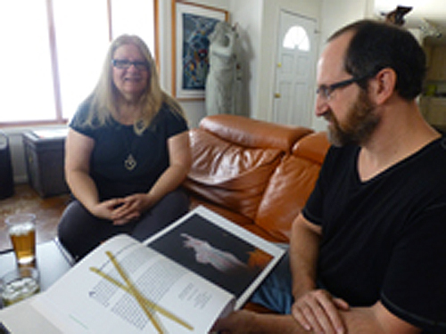 Debby and Larry Kline display their book of photos (accompanied by a Video DVD) showing dinner time art projects