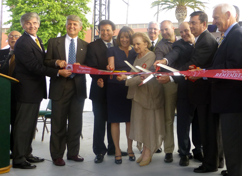 Ribbon cutters are from left, Fred Balitzer (behind podium), Tim Fennell, fair general manager; County Supervisor Dave Roberts; State Senator Marty Block; Congresswoman Susan Davis, Elane Geller, Sheriff Bill Gore (behind Geller), unidentified, Sen. Mark Wyland, Senator Joel Anderson, Supervisor Ron Roberts.