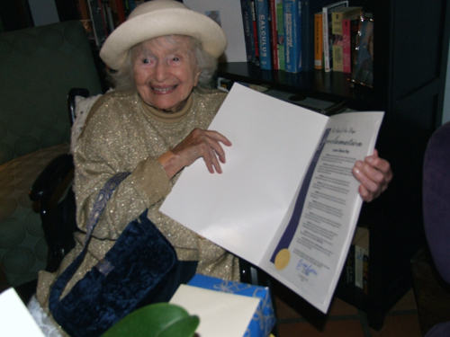 A happy Laura Simon, approaching her 108th birthday, displays mayoral proclamation declaring Nov. 26th to be her day in San Diego