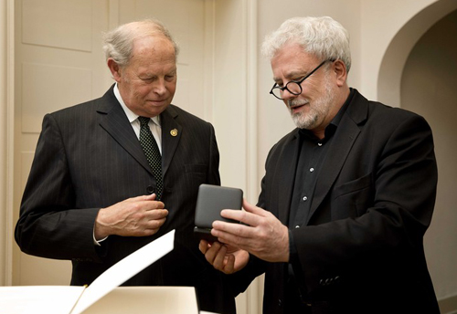 Garry Fabian, left, receives Gold Staufer medal from Baden-Wurtenberg Secretary of State Klaus-Peter Murawski
