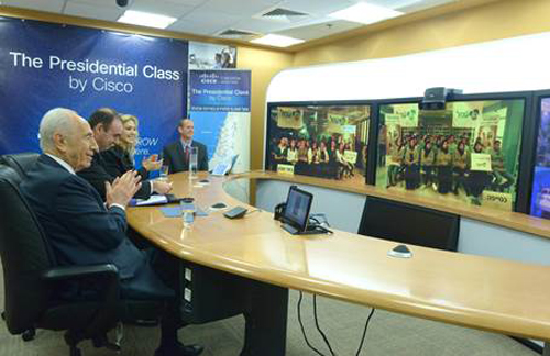 President Shimon Peres in foreground teaches an online class to Israeli students