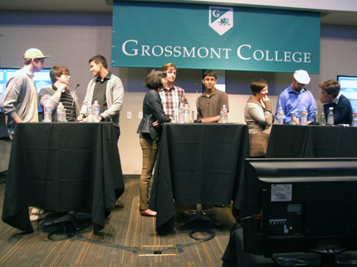 Teammates consult over "Final Jeopardy" question, from left. Point Loma: Thomas Routson, Caleb Moore, Brandon West; UCSD: Katherine Zu, James Dohleman, Anish Shandilya; and Grossmont: Jenna Bouche, Nathan Straign and Ryan Jerman (Photos: Donald H. Harrison)