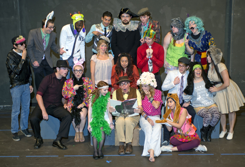 High-spirited cast of Alice in Wonderland gather around director Jerry Hager, reading book in front row. Grossmont College photo by Stephen Harvey