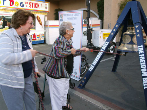 Reba Oberman, left, and Marilyn Greber ring The Freedom Bell at San Diego County Fair (Photo: Donald H. Harrison)