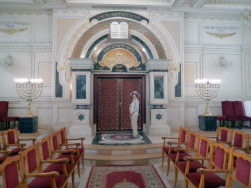 Roberta Greene stands at the aron kodesh in Casablanca synagogue