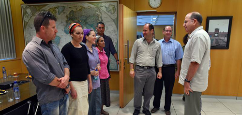 Moshe Ya'alon (right) meets with families of 3 kidnapped Israeli teens. Photo: Ariel Hermony/ MOD