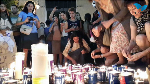 Mourners light candles for 3 teens found murdered June 30