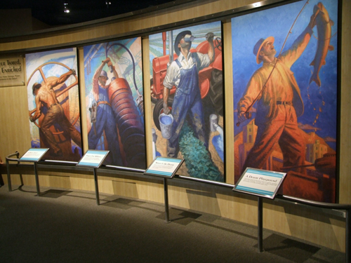 Paintings show four uses of the dam, from left, flood control, electrical power, bringing life-saving water to the desert, and recreation