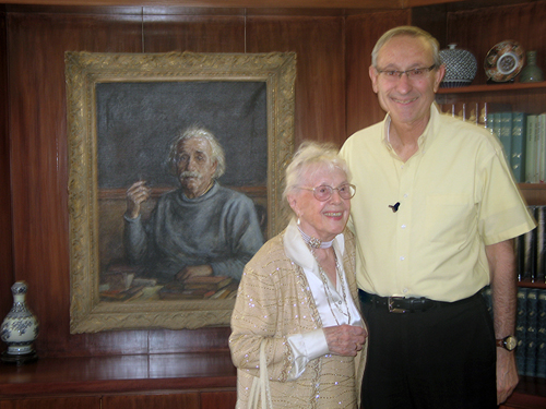 Gabriella Labson with Herew University President Menahem Ben-Sasson and portrait of man whose accomplishments both admire