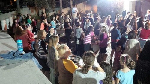 Women and girls learn to make challah at Beth Jacob Congregation