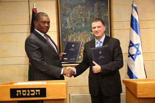 Justin Muturi shakes hands with Yuli Edelstein following Knesset ceremony
