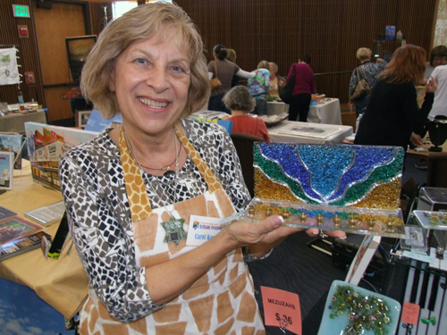 Carol Korfin with glass menorah