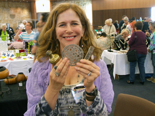 Jocelyne Okrent shows pieces of Judaica collected by her mother Rita from shops throughout the Middle East