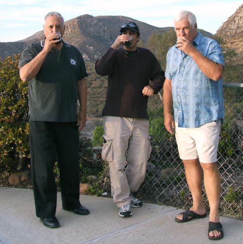 Taking their first swallows of Hanukkah, Chanukah Beer are from left, editor Donald H. Harrison, Shahar Masori, and Bob Lauritzen