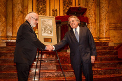Nathan Lewin, left, presents Benjamin Brafman with his award. Art piece in background depicts the "false trial" of Benjamin as told in the Genesis story about Joseph and his brothers.