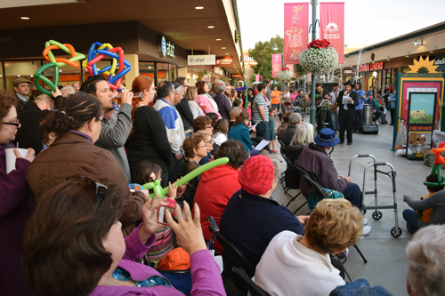 Gathering at Grossmont Shopping Center, with Rabbi Andrusier at right reading letter from the late Rebbe Menachem Mendel Schneerson