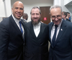 Sen. Cory Booker, left, with Ezra Friedlander and Sen. Charles Schumer