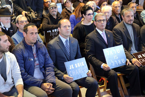 Mayor Nir Birkat of Jerusalem (third from left) participates in rally for French terror victims