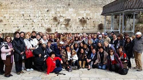 Na'amat delegates from nine countries at the Kotel in Jerusalem