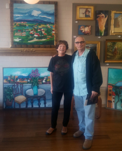 Gallery owner Shannon O'Dunn and artist Aaron Zigel with some of his work in the background