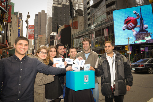 At Nefesh B' Nefesh, Yossi Cohen of L.A., at left, is joined in voting for aliyah by New Yorkers Rosalie Soussan, Abby Soussan, Jesse Bass, Saul Daiell, Michael Brenner. and Yaakov Hatanian.