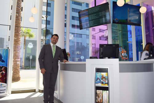 Aleksey Shafiro stands by the information counter that is the focus of the interior space