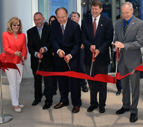Ribbon to new information center is cut by from left, Nancy Swift {wife of HTA President Ed Swift}, Dave Thornton, Ed Swift, Marshall Merrifield, and John Balduc