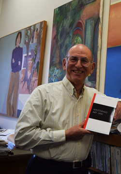 Bert Lazerow displays his book on art law