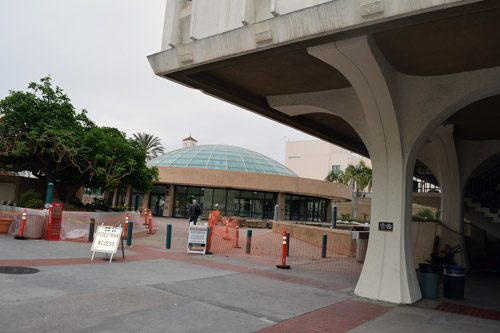 A portion of SDSU's Malcolm A. Love library is in foreground; entrance is through the domed building in background.