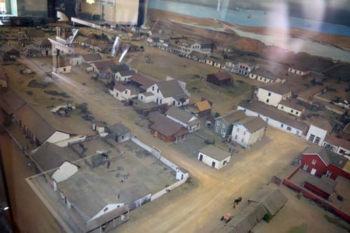 Diorama inside Robinson-Rose House shows what Old Town might have looked like in the mid-19th century. Street on left side of picture is Juan Street. Next street to the right was Camino de Judios, and street further to the right faced the plaza. The Colorado House, where Mannasse's picture hangs, is on the other side of the Plaza.