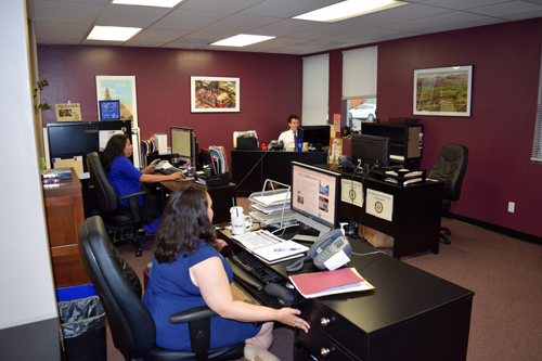 Open floor plan of staff room facilitates taff members communicating with each other. Clockwise those shown are Margaret Hernandez, Jessica Mier and Daniel Hazard.