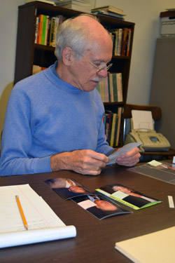 Stan Schwartz reviews photos from donated collection of the Jewish Federation of San Diego County