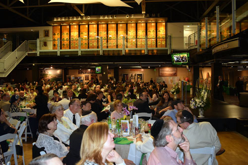 Attendees at Soille San Diego Hebrew Day School watch a video presentation about honorees. Above are plaques honoring members of the Breitbard Sports Hall of Fame at the San Diego Hall of Champions.