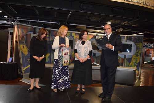 Rabbi Simcha Weiser, right, presents to Margrit Bitton, center, a plaque of appreciation for her ten years as preschool director. She is flanked on right by her predecessor Faye Snyder, and her successor to be, Rachel Seidle