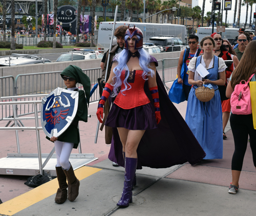Fans in costume arrive at Comic-Con held at the San Diego Convention Center