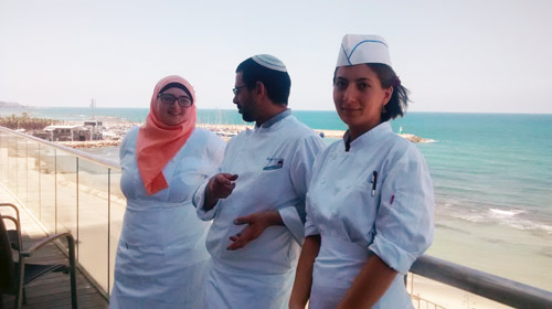 Culinary students, Roaa Msarwa and Alina Khalaman with their teacher, Oneg Etz Chaim (center) at the Tel Aviv Hilton Hotel. (Photo: Anav Silverman, Tazpit News Agency)