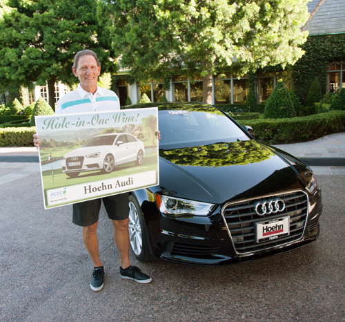 Hole in One winner Constantino “Connie” Salios at golf tournament sponsored by the Guardians for the Seacrest Village Retirement Communities displays his winnings