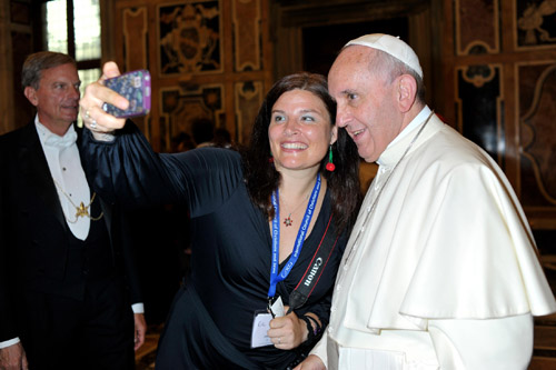 Official photographer takes photo of Jenn's selfie with Pope Francis (Photo: L'Osservatore Romano.)