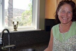 Melissa Stroh burns Shabbat candles in her kitchen window on Friday nights