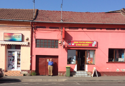 Former California Assemblyman Howard Wayne at building in Romania where his great-grandfather resided