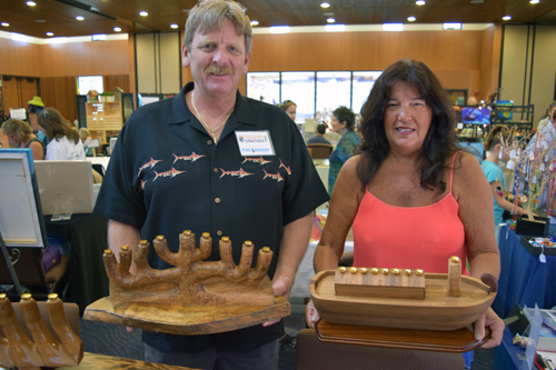 Woodworker Peter Luchsinger and his wife, Joyce, display a Tree of Life and a Noah's Ark