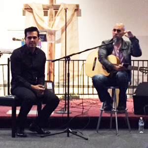 Jonathan Valverde, left, leader of Latinos for Israel, on stage with Zeji Ozeri.