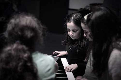 Young cast members rehearse for "Sisters"