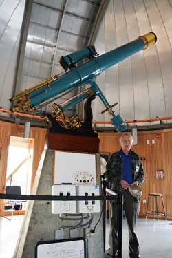 Rick Kalish, a volunteer guide at the Chabot Space and Science Center, poses with "Leah"
