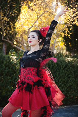Amber Bart;ett as Mayzie La Bird